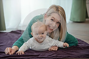 Young mother playing with baby girl