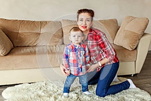 Young mother playing with her child