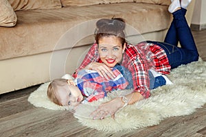 Young mother playing with her child