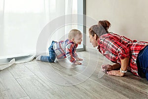 Young mother playing with her child