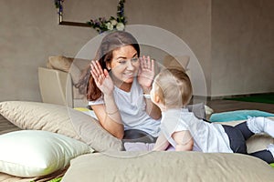 Young mother playing with her child