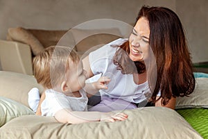 Young mother playing with her child