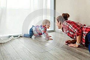 Young mother playing with her child