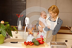 Young mother preparing baby food