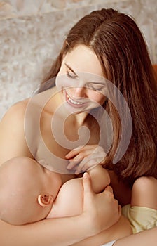 Young mother preparing breastfeed