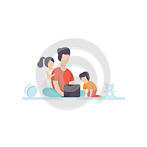 Young Mother Sitting on Floor and Working on Laptop Computer, Her Daughter and Son Playing Next to Her, Freelancer