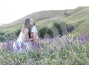 Young mother with son on the summer medow