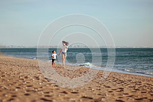 Young mother with son in white T-shirts