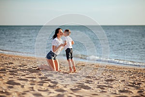 Young mother with son in white T-shirts