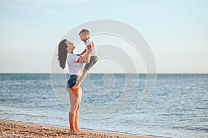 Young mother with son in white T-shirts