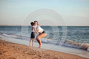 Young mother with son in white T-shirts