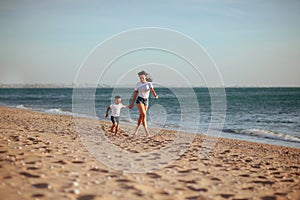 Young mother with son in white T-shirts