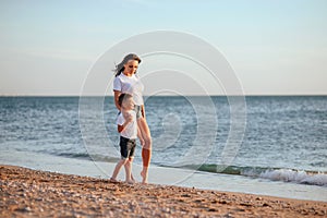 Young mother with son in white T-shirts