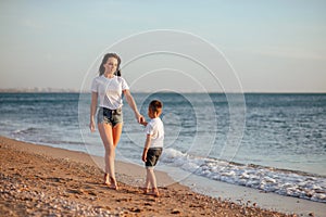 Young mother with son in white T-shirts