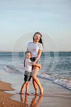 Young mother with son in white T-shirts