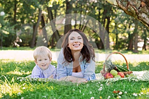 Young mother spending time with her son in the park