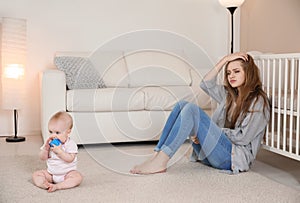 Young mother suffering from postnatal depression photo
