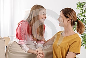 Young mother talking with her teenager daughter