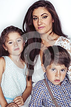 young mother with two children on white background isolated, happy smiling family, lifestyle people concept