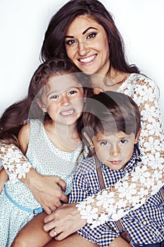 young mother with two children on white background isolated, happy smiling family, lifestyle people concept