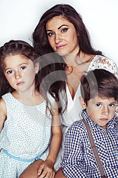 young mother with two children on white background isolated, happy smiling family, lifestyle people concept