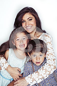 young mother with two children on white background isolated, happy smiling family, lifestyle people concept