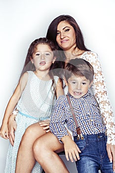 young mother with two children on white background isolated, happy smiling family, lifestyle people concept