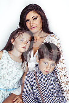 young mother with two children on white background isolated, happy smiling family, lifestyle people concept