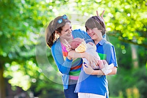 Young mother with two kids in a park