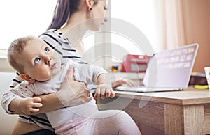 Young mother working from home