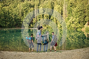 Young motivated explorers spending summer holidays in the forest