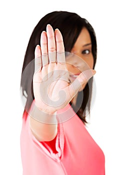 Young mulato woman making stop sign