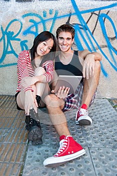 Young multi-ethnic couple using a tablet pc.