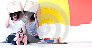 Young multiethnic couple playing with cardboard boxes