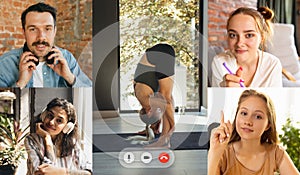 Young multiethnic people, men and women watching yoga trainings, sport tv programme using video app. PC, laptop screen