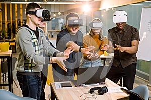 Young multiracial business People wearing virtual reality goggles with touching air during VR Meeting Conference at the