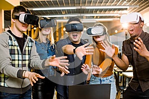 Young multiracial business People wearing virtual reality goggles with touching air during VR Meeting Conference at the