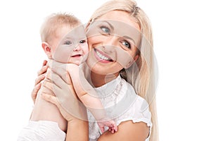 Young mum hugging small baby. beautiful blond holding baby and smiling