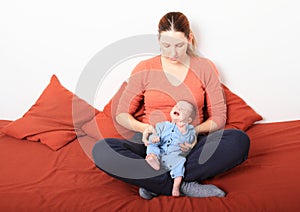 Mum with crying newborn baby girl