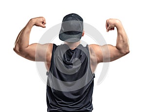 Young muscular guy shows arm muscles - biceps.