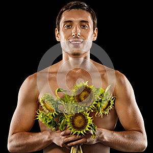 young muscular man with a bouquet of flowers