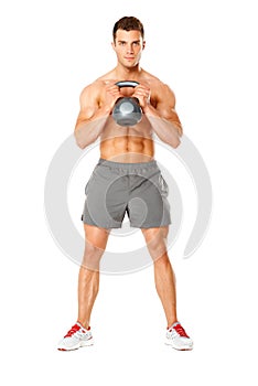 Young muscular man lifting weights on white