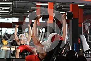 Young muscular man in Santa costume training