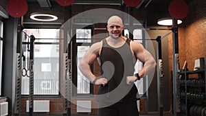 Young muscular man with sexy strong body. Fitness man at workout in gym pumping up muscles. Fitness and bodybuilding