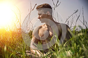 Young Muscular Shirtless Hunk Man Outdoor in Nature