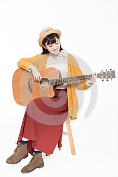 Young musician holding a guitar