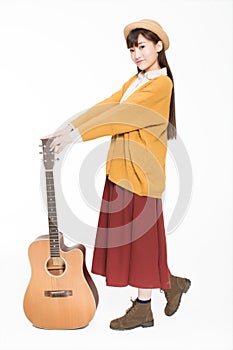 Young musician holding a guitar