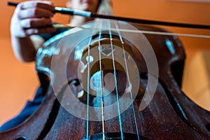 Young musician playing on the double bass