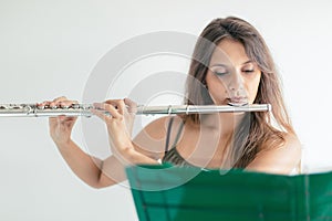 Young musician playing the flute