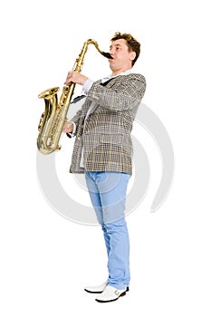A young musician plays the saxophone